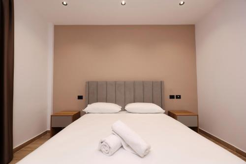 Postel nebo postele na pokoji v ubytování Emar Hotel