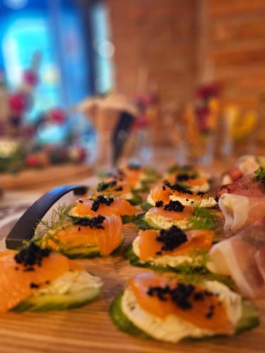 a bunch of food on a wooden table at Pensiunea Senin in Sovata