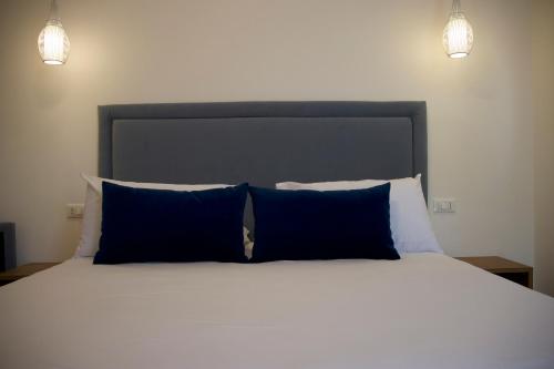 Ένα ή περισσότερα κρεβάτια σε δωμάτιο στο Galaxy Rooms Tropea