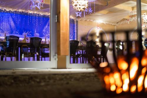 a dining room with a table with black chairs at Hotel Estricher Hof in Trier