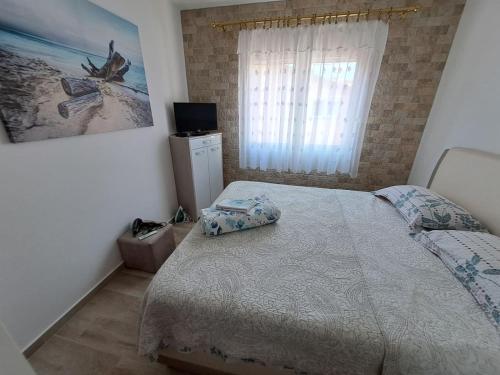 Postel nebo postele na pokoji v ubytování Apartman Dragana