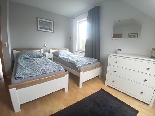 Postel nebo postele na pokoji v ubytování Ferienwohnung in 18107 Elmenhorst kurz vor Warnemünde
