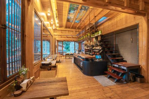 a large room with wooden walls and ceilings and a library at 雾里观阵山 Foggy Valley in Zhangjiajie