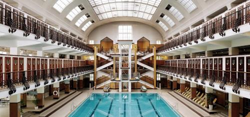 a large library with a swimming pool in the middle at Favoriten Apartments in Vienna