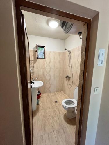 a bathroom with a toilet and a sink at к-г Луна к-с Лонгоза комплекс Лонгоза in Byala