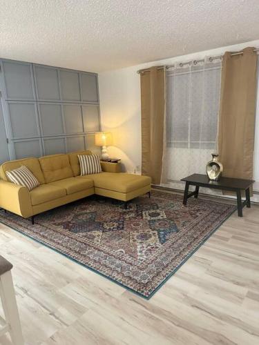 a living room with a couch and a table at Beautiful downtown Anchorage 2 in Anchorage