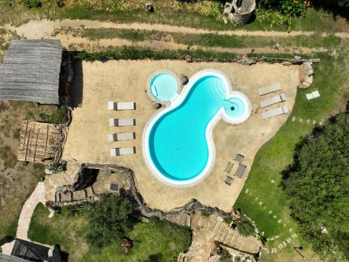 an aerial view of a swimming pool in a backyard at Luxury Home in Porto Rotondo in Cugnana