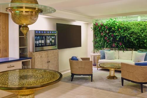 a living room with a couch and a table at ESPACIO THE JEWEL OF WAIKIKI in Honolulu