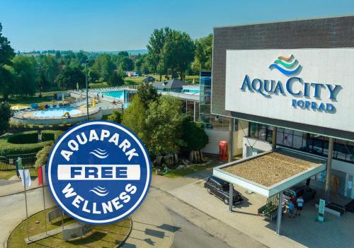 a building with a sign for a swimming pool at Hotel AquaCity Mountain View in Poprad