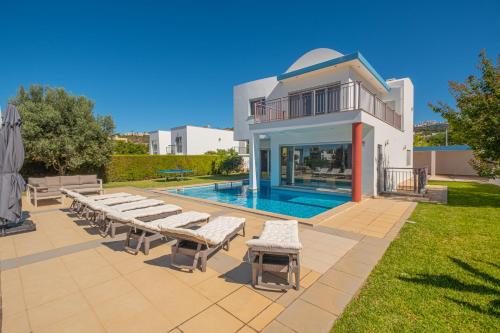 a villa with a swimming pool and a house at Capetown Marina Luxury Villa - Private Pool in Albufeira