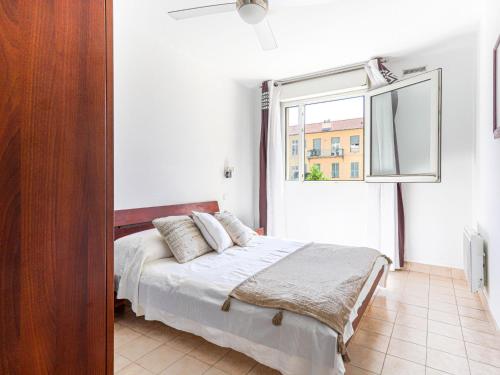 A bed or beds in a room at Apartment Cap Californie by Interhome