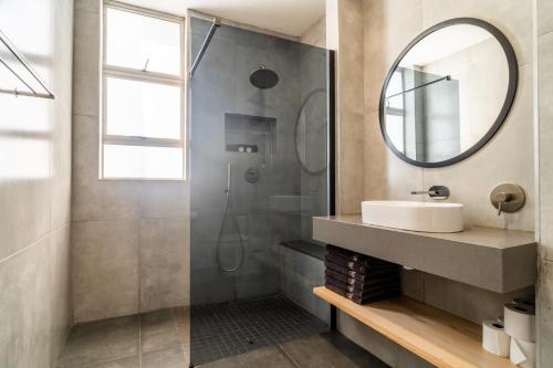 a bathroom with a sink and a mirror at ATKV Natalia in Kingsburgh