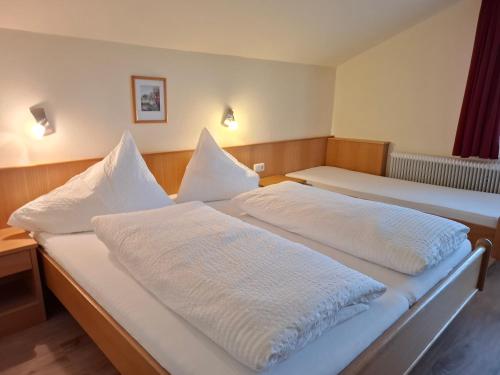 Postel nebo postele na pokoji v ubytování Pension Stammerhof