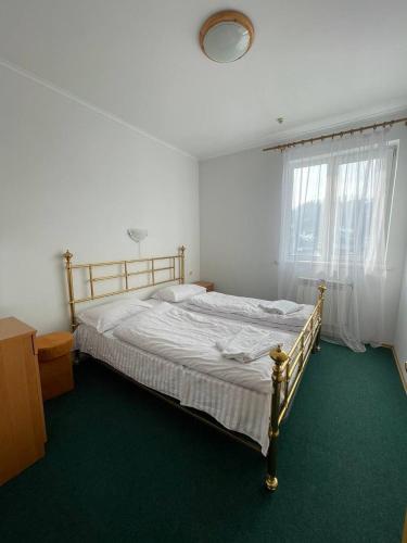 Postel nebo postele na pokoji v ubytování Tourkomplex Karpaty