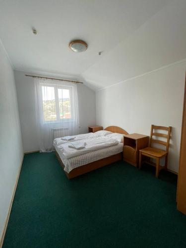 Postel nebo postele na pokoji v ubytování Tourkomplex Karpaty