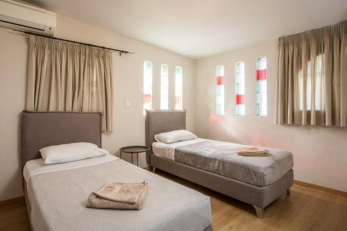 Postel nebo postele na pokoji v ubytování GM Villa Kallithies Village