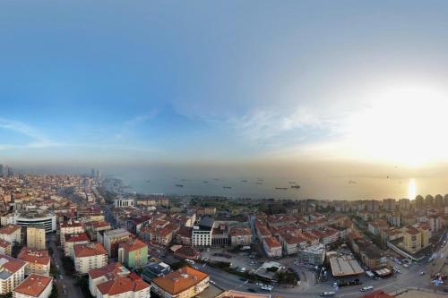 an aerial view of a city with buildings and the ocean at The Grand Mira Business Hotel in Istanbul