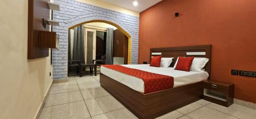 a bedroom with a large bed in a room at Golden Himalaya Homestay in Kausani