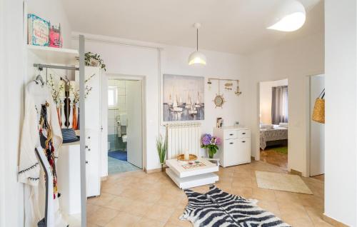 a room with white walls and a room with a rug at Awesome Apartment In Cavtat With Wifi in Cavtat