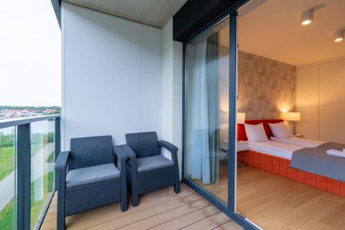 Giường trong phòng chung tại Blue Pearl - Relaxation - Sauna, Pool, Fitness