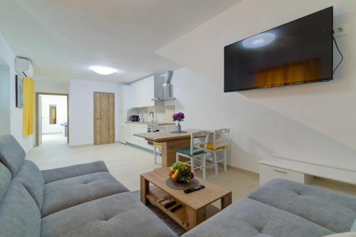a living room with a couch and a table at Apartmani Maka in Senj
