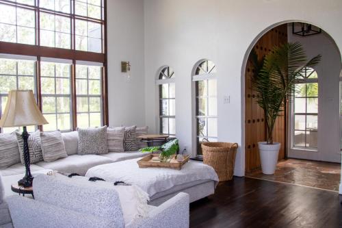 a living room with a couch and a table at Chateau Mariposa in Spring Hill