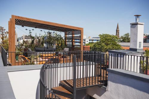 a balcony with a gate and stairs on a building at The Circus Apartments in Berlin