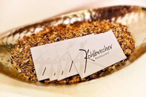 a bowl of oatmeal with a sign on it at Hotel Restaurant Kohlbrecher Villeroy & Boch in Osnabrück