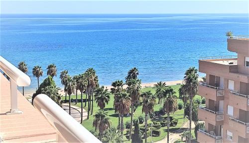 a view of the ocean from the balcony of a building at Apartamentos varios con 2 dorm en Marina Dor , la playa de Amplaries 47 , vista lateral al mar in Oropesa del Mar