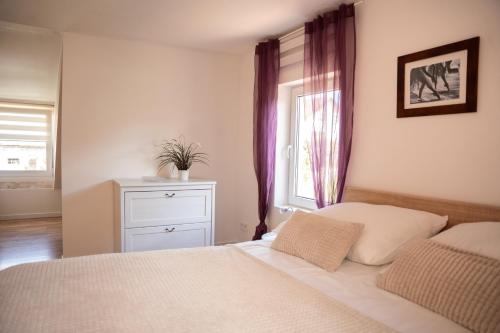 Ένα ή περισσότερα κρεβάτια σε δωμάτιο στο Apartament Lipowa