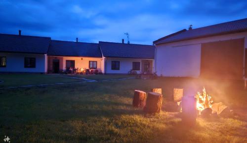 a fire in a yard in front of a building at Residence Budákov in Dolní Dvořiště