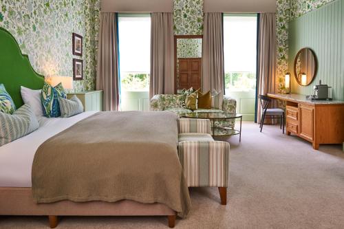 a bedroom with a large bed and a desk at Hotel Du Vin & Bistro York in York
