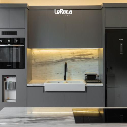 a kitchen with a sink and a counter top at LeRoca Villa in Bandung