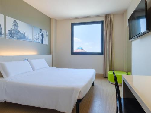Postel nebo postele na pokoji v ubytování B&B Hotel Ferrara