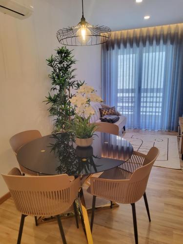 a living room with a table and chairs and a couch at My Home in Braga