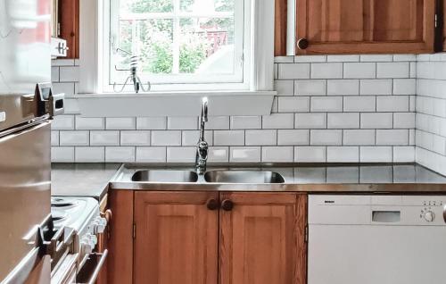 a kitchen with a sink and a window at Lovely Home In Sälen With Sauna in Sälen