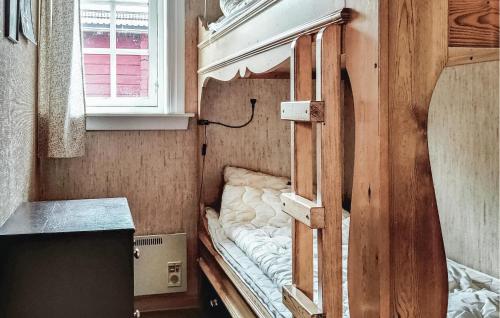 an empty bunk bed in a room with a window at Lovely Home In Sälen With Sauna in Sälen
