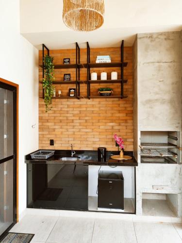 a kitchen with a sink and a counter top at Horizonte Azul in Búzios
