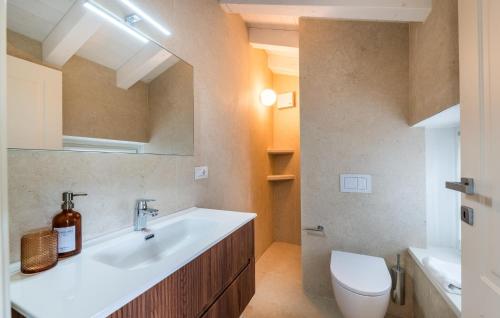 a bathroom with a sink and a toilet at Nice Home In Costermano Sul Garda in Costermano sul Garda