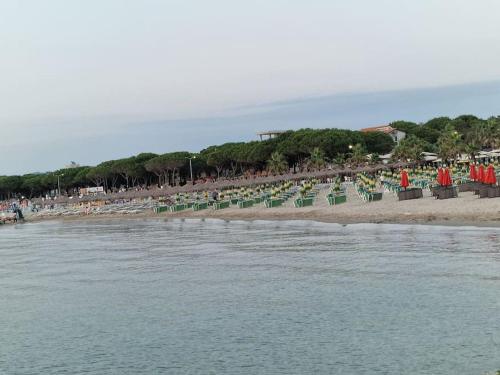 a group of chairs on a beach next to the water at Villa Pearl Adriatic Coast in Golem