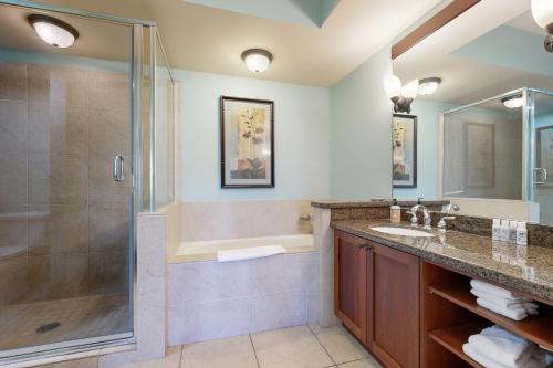 a bathroom with a shower and a sink at Halii Kai 18E - Waikoloa in Waikoloa