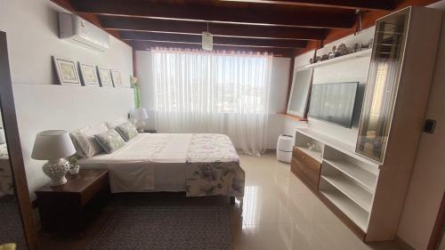 Μια τηλεόραση ή/και κέντρο ψυχαγωγίας στο Hospedaje EMPRESARIAL AV VELASCO ASTETE