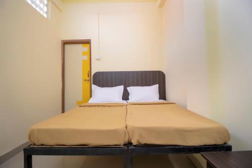 Cama o camas de una habitación en SPOT ON Shree Gajanan