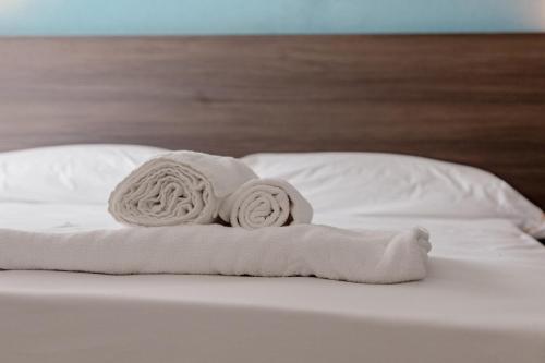 Postel nebo postele na pokoji v ubytování Hotel BluMarine