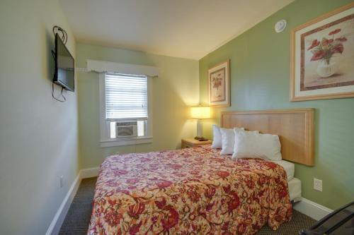 a bedroom with a bed and a window at Ocean Lodge Hotel South in Ocean City