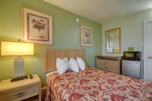 a hotel room with a bed with two pillows at Ocean Lodge Hotel South in Ocean City