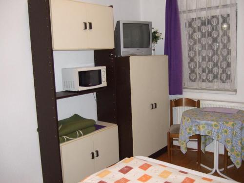 Orchidea Apartmanにあるテレビまたはエンターテインメントセンター