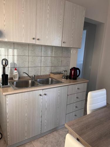 a kitchen with a sink and a counter top at Liostasi Hοuse in Mákri