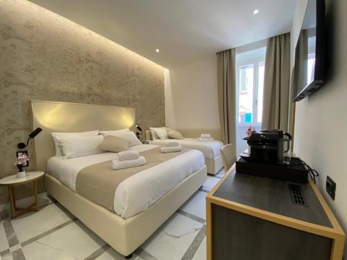 Postel nebo postele na pokoji v ubytování Suite Croce