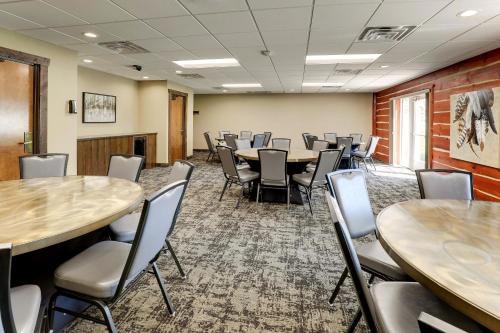 a conference room with tables and chairs in it at Stoney Creek Hotel La Crosse - Onalaska in Onalaska